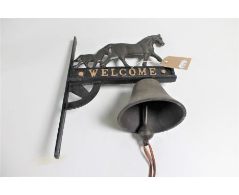 A cast iron bell on bracket - welcome 