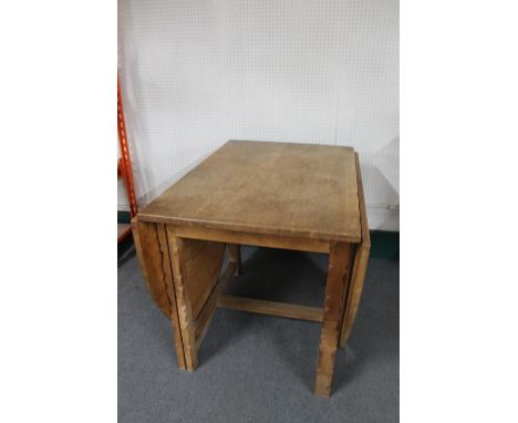 A blonde oak gate leg table 