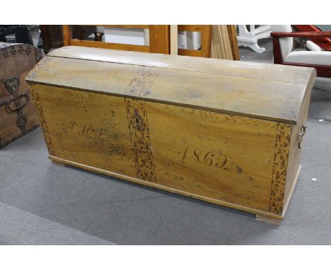 A 19th century domed topped shipping trunk (locked, no key) CONDITION REPORT: 143cm by 60cm by 65cm. Some woodworm visible to
