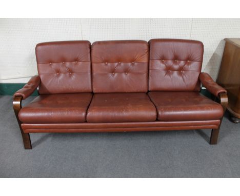 A mid 20th century Danish wood framed brown button leather settee 