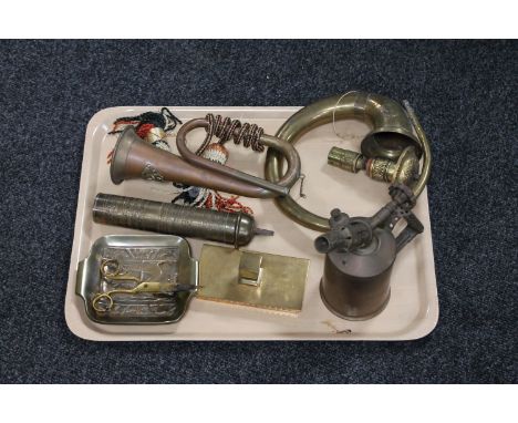 A tray of two antique horns, vintage brass blow lamp, part brass spit etc 