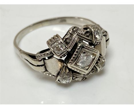 An Art Deco platinum and diamond ring, size R1/2 CONDITION REPORT: This is not hallmarked but in my opinion would test as pla