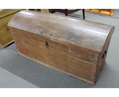 A 19th century domed topped shipping trunk with key  CONDITION REPORT: 136cm wide by 58cm deep by 65cm high. Split to top. so