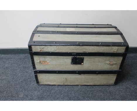 An early 20th century wooden bound shipping trunk 