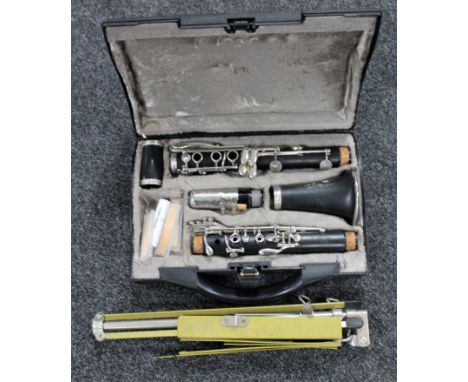 A five piece Crampon &amp; Company of Paris clarinet in fitted case, together with a music stand 