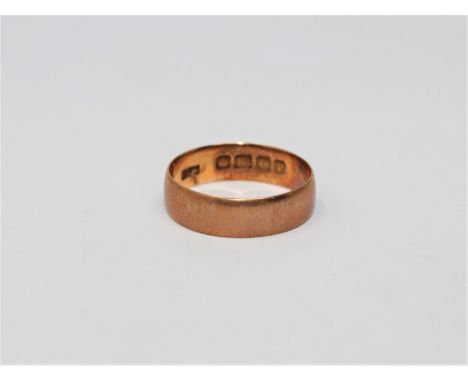 An 18ct gold band ring, size L.  CONDITION REPORT: 2.5g