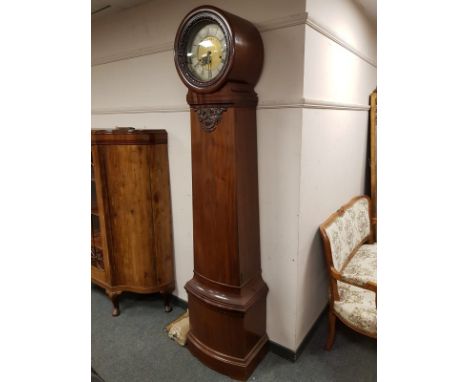 A nineteenth century mahogany drum head longcased clock, height 210 cm.