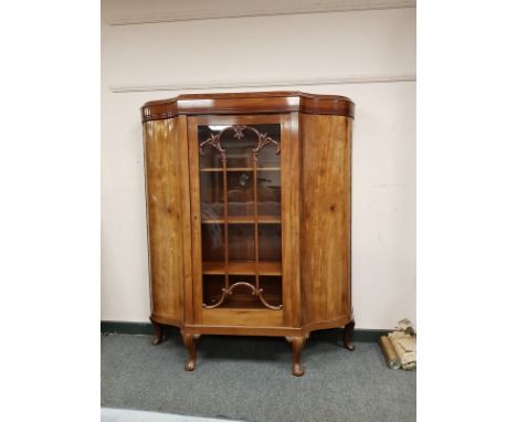 An early twentieth century mahogany bow fronted glazed cabinet, width 126 cm