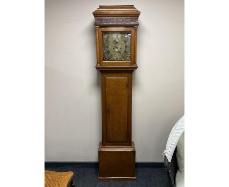 An antique oak longcase clock with later movement with brass dial signed John Mercer 