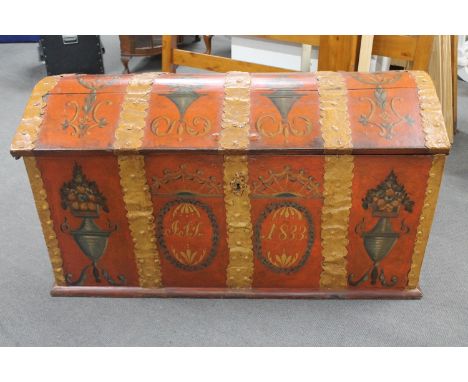 A 19th century hand painted domed topped shipping trunk with key with metal fittings 