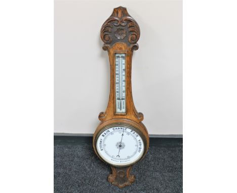 An Edwardian oak aneroid barometer 
