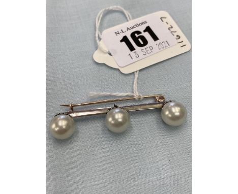 18ct Gold, Platinum and Silver brooch set with Pearl