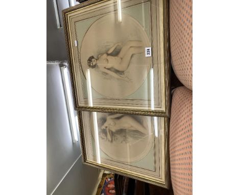 A pair of gilt framed prints of nudes