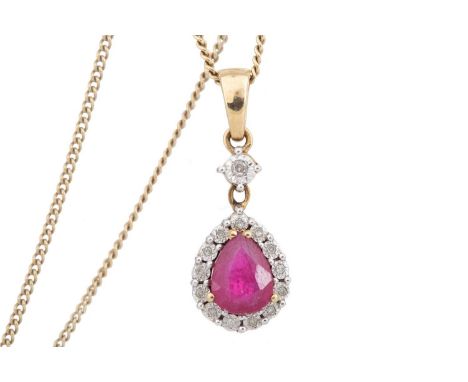 RUBY AND DIAMOND PENDANT set with pear shaped ruby within a halo of illusion set diamond chips, in nine carat gold
