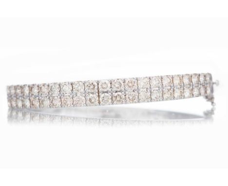 DIAMOND BANGLE the round brilliant cut diamonds totalling approximately 7.00 carats, in nine carat white goldQty: 19.8g60mm i