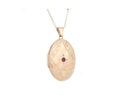 RUBY LOCKET set with central ruby, unmarked, on a nine carat gold chain