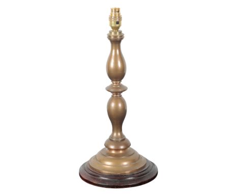 A GROUP OF THREE BRASS TABLE LAMPS including a baluster form vase lamp with a ribbed body, 36cm high, a turned candlestick la