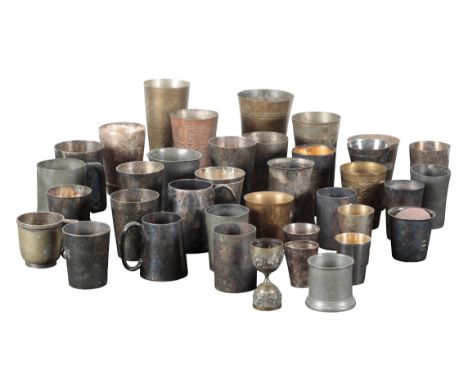 A LARGE COLLECTION OF CUPS AND BEAKERS including eastern brass engraved cups, English pewter tankards, and others (a lot)Prov