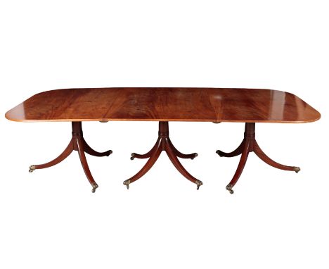 A FINE GEORGE III STYLE THREE PILLAR MAHOGANY EXTENDING DINING TABLE early 20th century, 76cm high x 122.5cm wide x 275cm lon