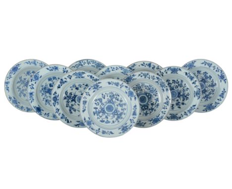 A GROUP OF TEN CHINESE EXPORT PLATES 18th century, decorated in blue and white with flowers and foliage, 22cm wide (10)