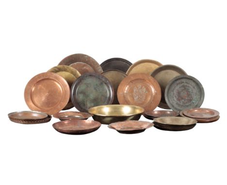 A LARGE COLLECTION OF COPPER AND BRASS PLATES predominantly 19th century, the largest 37cm wide, the smallest 22cm wide (a lo