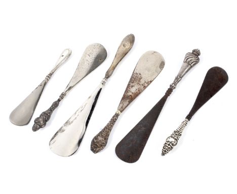 A collection of six silver and white metal handled shoe horns, 19th century and later. Each with steel horn, including severa