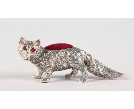A SMALL SILVER NOVELTY FOX PIN CUSHION.
