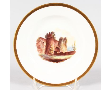 A 19TH CENTURY SPODE PLATE painted with a view of Amberley Castle, Sussex, titled verso.