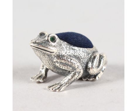 A SILVER FROG PIN CUSHION.