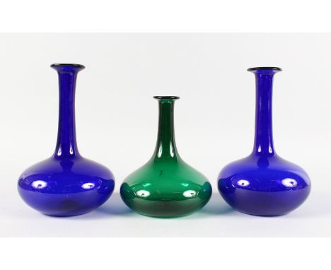 A PAIR OF BRISTOL BLUE DECANTERS and A GREEN DECANTER (3).