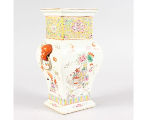 A SHAPED CHINESE VASE with ring handles and painted with flowers, with Jiaqing mark. 8ins high.