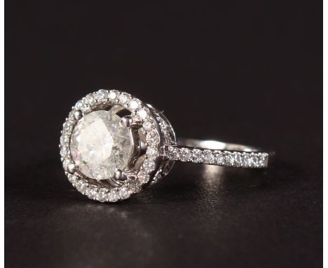 A GOOD 14CT WHITE GOLD DIAMOND HALO SHAPED CLUSTER RING of approx. 2CTS.