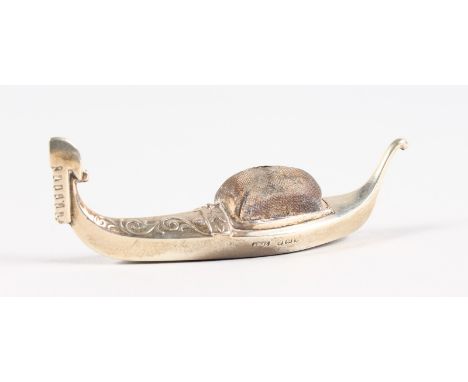 A GONDOLA PIN CUSHION. Birmingham 1910.  Maker: A. & Z.  9.5cms long.