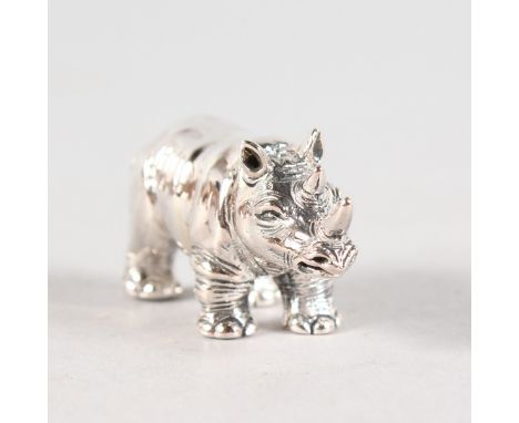 A SILVER RHINO PIN CUSHION.