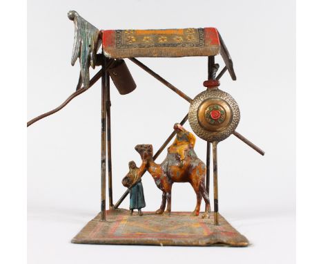 A BERGMAN STYLE COLD PAINTED SPELTER LAMP, modelled as Arab figure and a camel under a shelter. 9ins high.