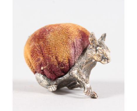 A SILVER SQUIRREL PIN CUSHION. Stamped SILVER.  6.5cms long.