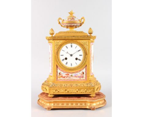 A GOOD LOUIS XVI GILT ORMOLU CLOCK with porcelain panels, urn surmount and pineapple finial, eight-day movement, stamped JPD,