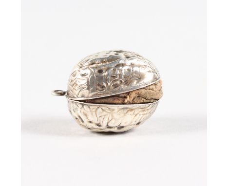 A MINIATURE WALNUT PIN CUSHION. 3cms long.