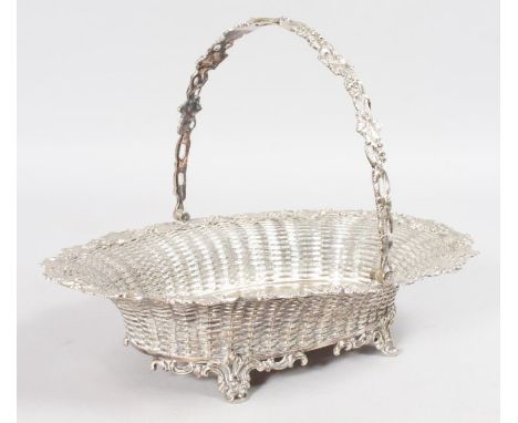 A GOOD LATTICE WORK OVAL BREAD BASIN with swing handle.