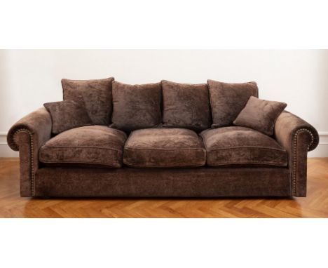 Classic design sofa from the beginning of the 21st century.Brown velvet upholstery and nailed decoration.In good condition.Th