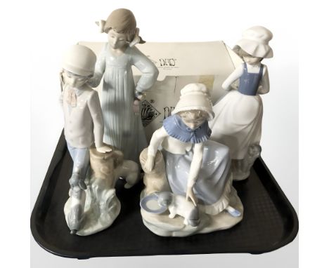 Four various Nao figures of girls, one boxed, tallest 25 cm.