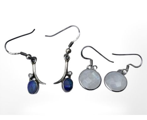 A pair of silver diamond and opal earrings, plus another faceted moonstone pair