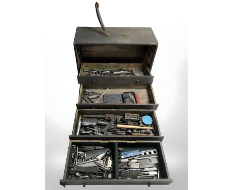 A vintage joiner's tool chest containing various tools and hardware, drill bits, etc. 