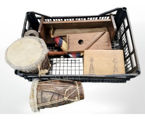 Two African hide coloured drums, a stringed instrument, book trough, recorders etc 