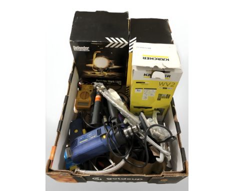 An electric drill, hand tools, Karcher window washer, portable work lights and work wear 