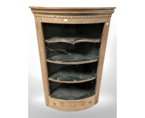 A Victorian pine bow fronted corner shelf 
