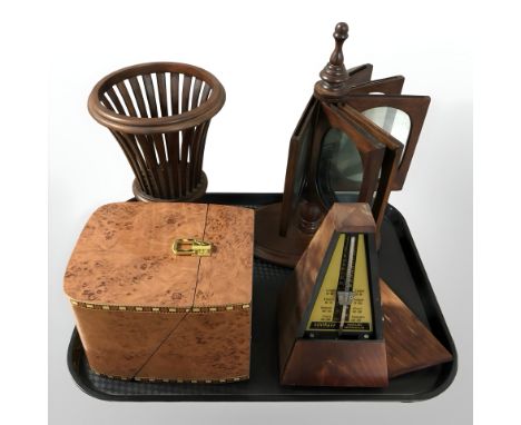 A lacquered burr walnut box, metronome, mahogany revolving picture frame and a further basket 