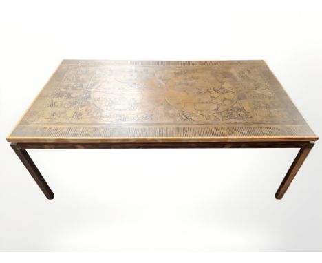 A Continental rectangular coffee table with embossed metal inset top depicting the globe, 140 cm long x 80 cm wide x 51 cm hi
