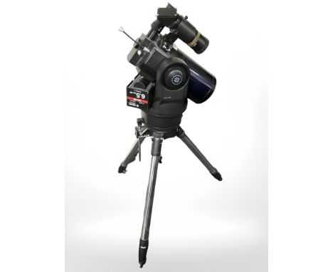 A Meade computer control telescope on tripod.