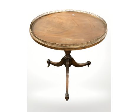 A reproduction mahogany tripod table with galleried top, diameter 59 cm.